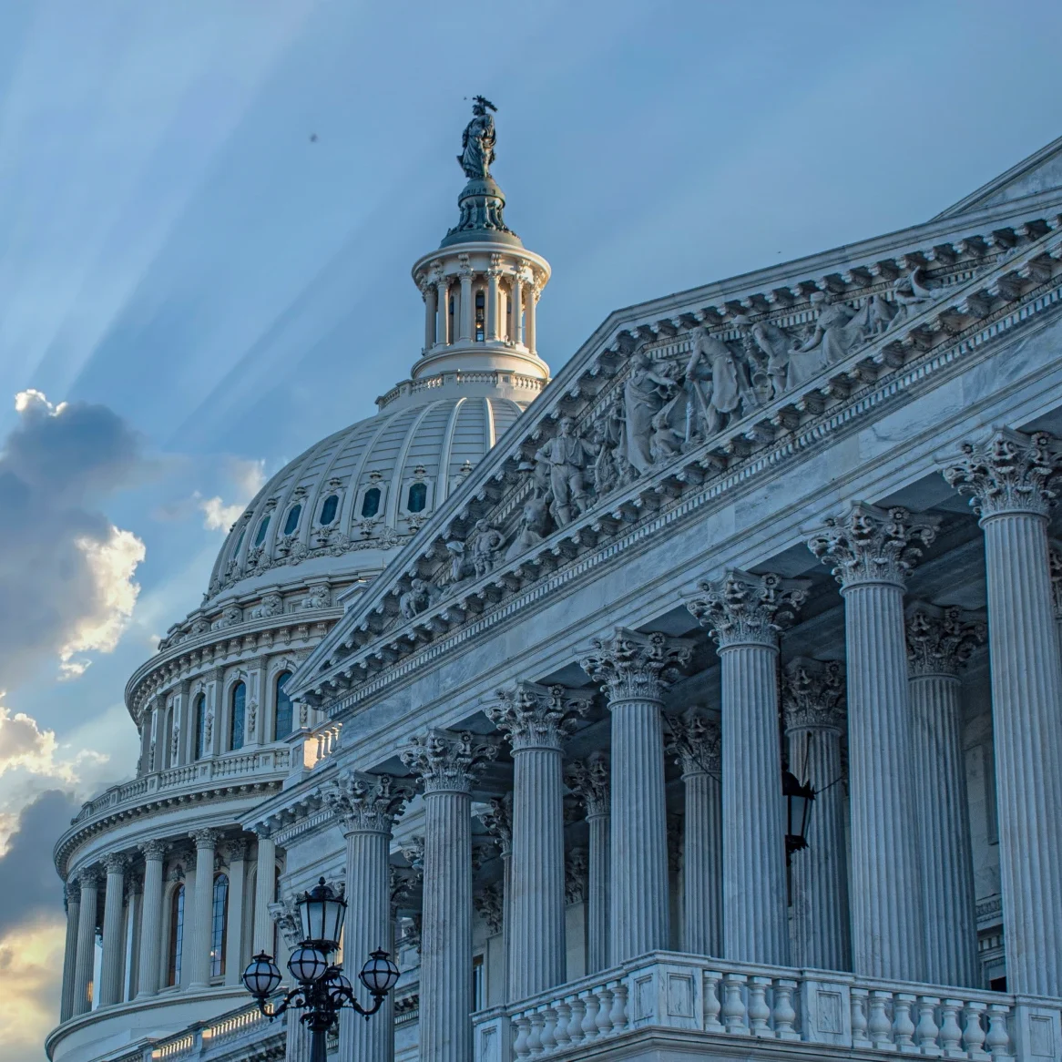 U.S. Capitol building with dramatic sky.